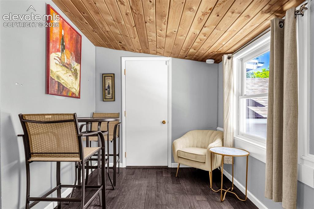 Image 14 of 21: Wood-paneled ceiling with an angled design