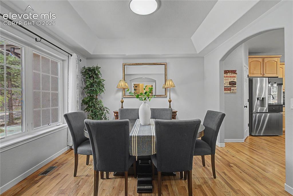 Image 6 of 48: Formal DR w/Hardwood Flooring & Recessed Ceiling