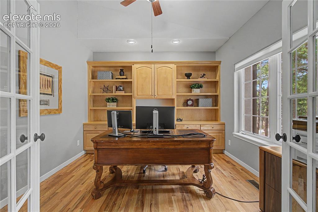 Image 7 of 48: Private Study/Office w/French Doors & Built In Cabinetry
