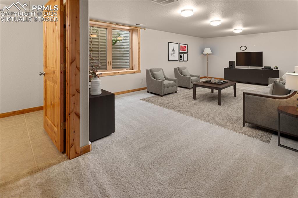 Image 14 of 37: Lower Level Family Room - Virtually Staged