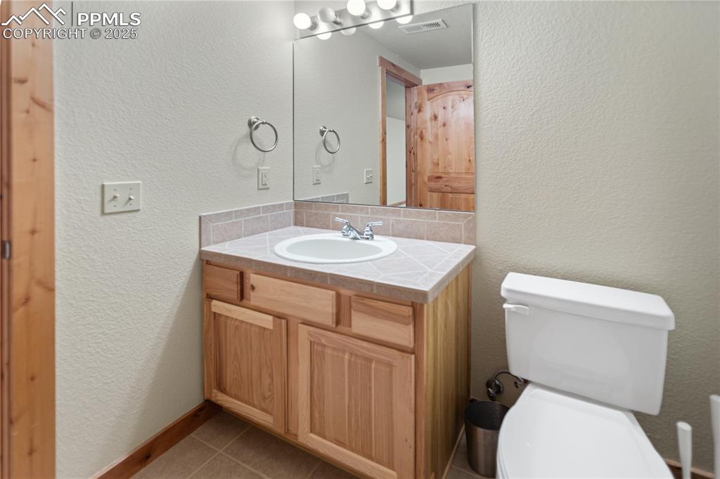 Image 15 of 37: Lower Level Guest Bath