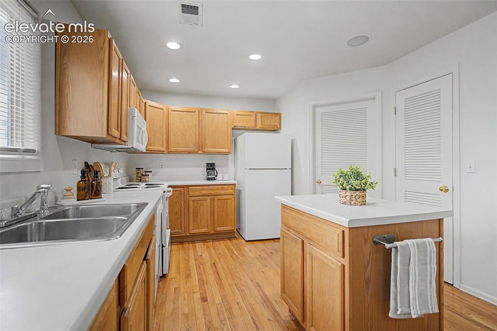 Image 11 of 22: Bright Kitchen with Ample Counter Space