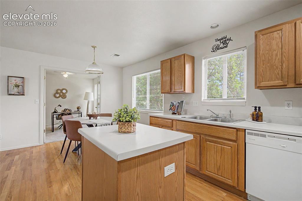 Image 12 of 22: Kitchen Open to Dining Area