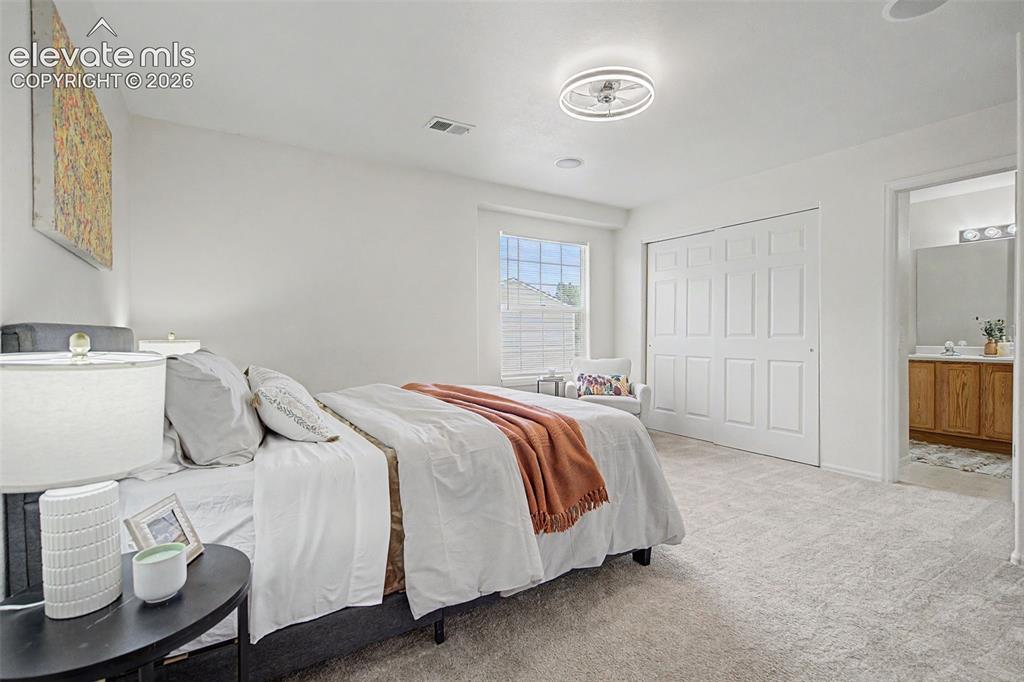 Image 18 of 22: Bright Primary Bedroom with Large Window