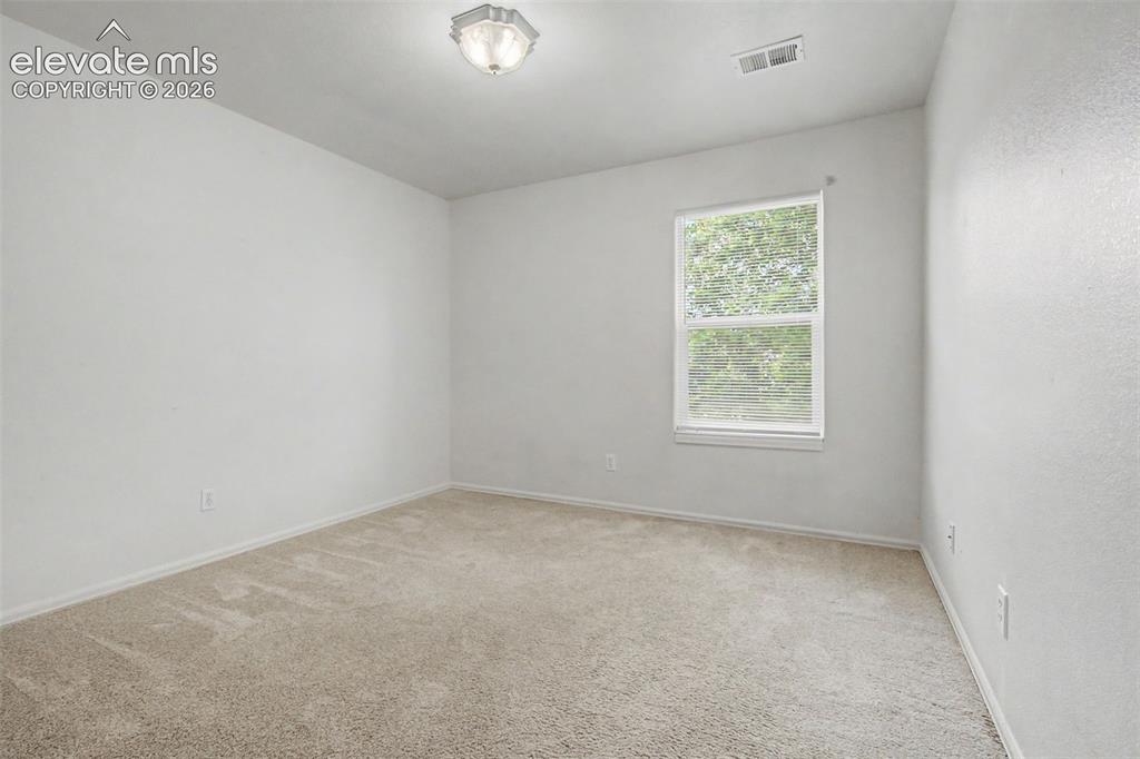 Image 20 of 22: Bright Secondary Bedroom