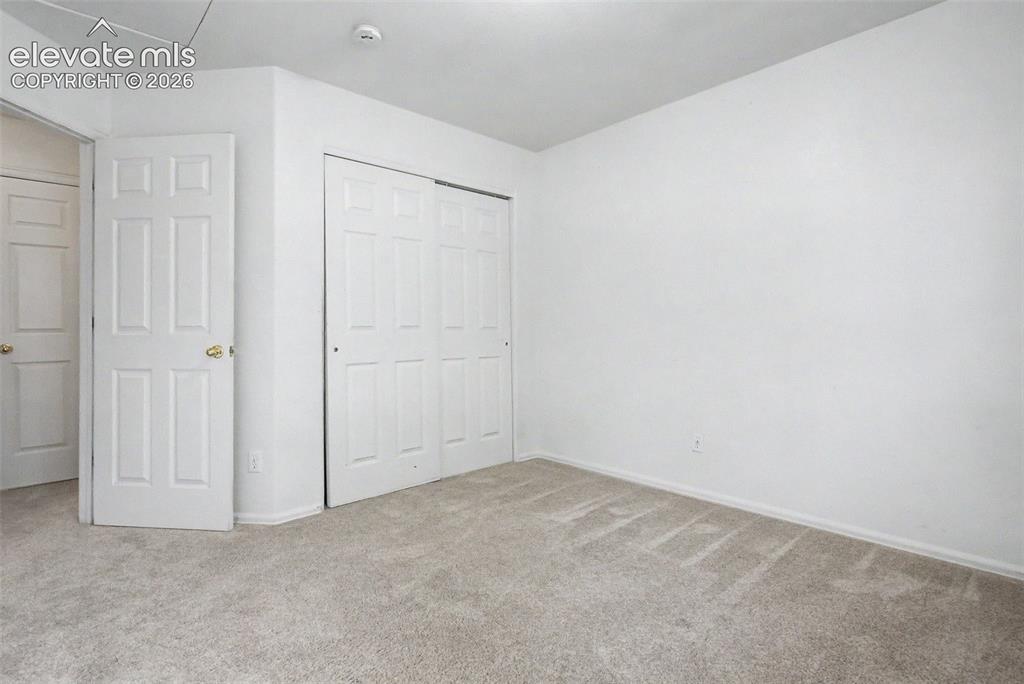 Image 21 of 22: Secondary Bedroom with Ample Closet Space