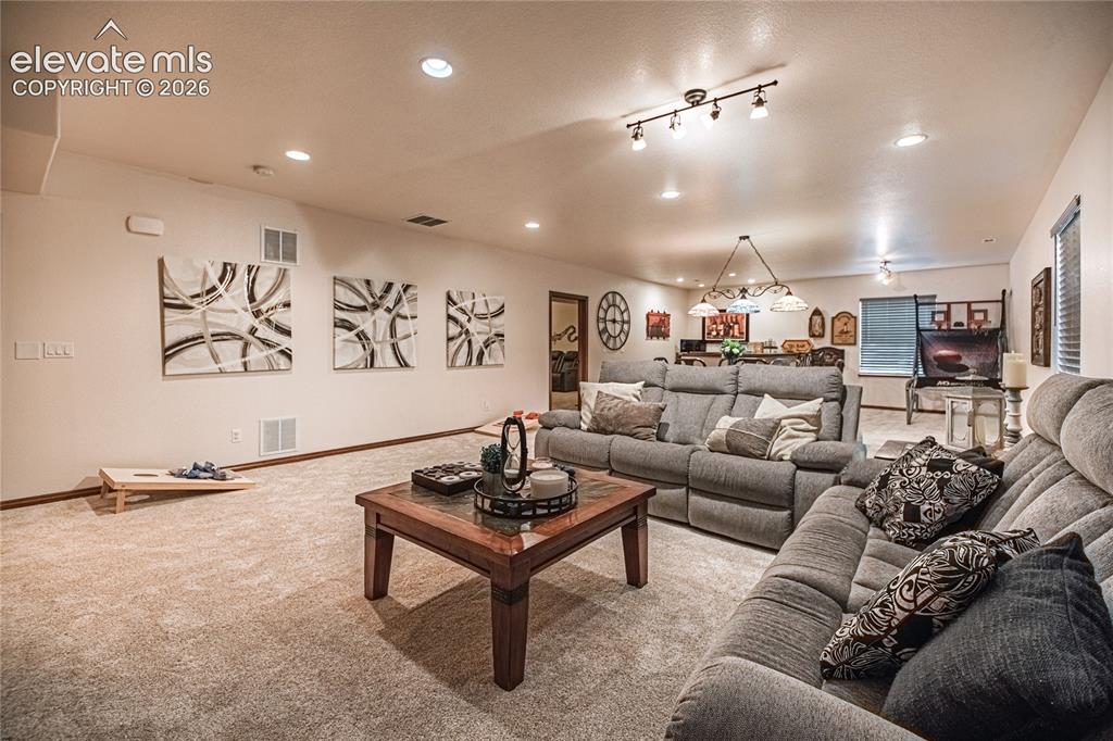 Image 26 of 50: Expansive recreation area featuring recessed lighting, track lighting, and