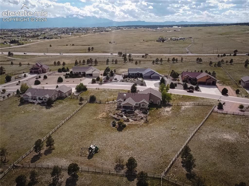 Image 44 of 50: Expansive property featuring a large residence with a multi-gabled roofline
