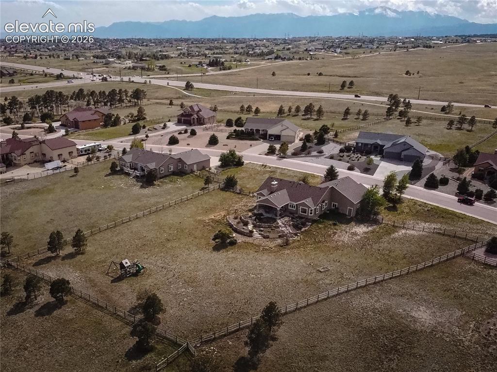 Image 46 of 50: Expansive property featuring a fenced perimeter, substantial open space, an