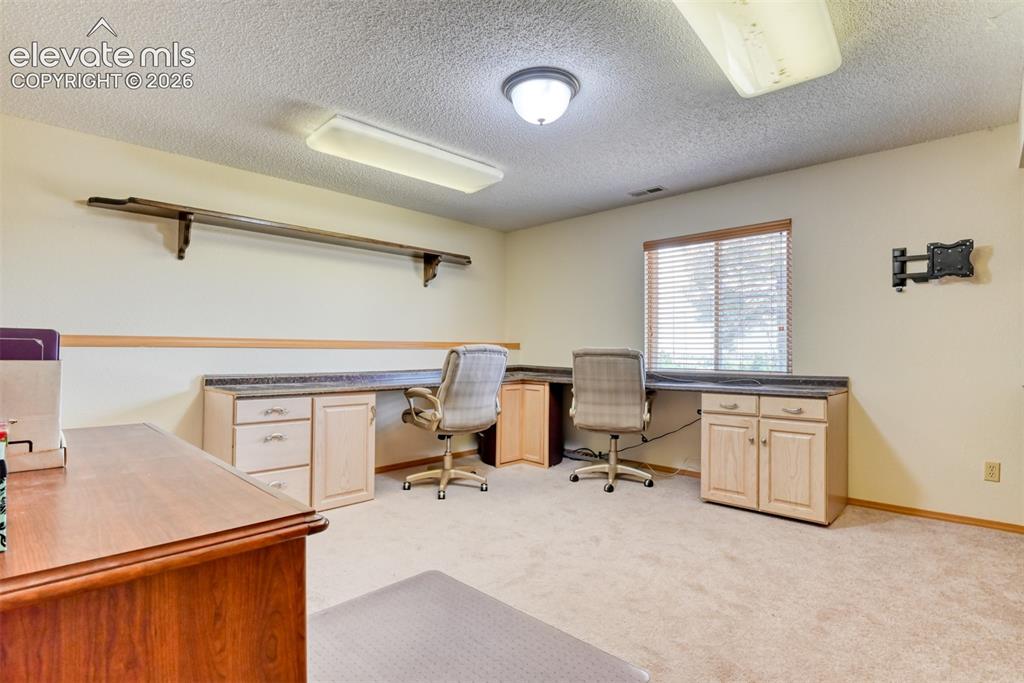 Image 28 of 44: This 3rd bedroom is currently being used as an office. It too has a spaciou