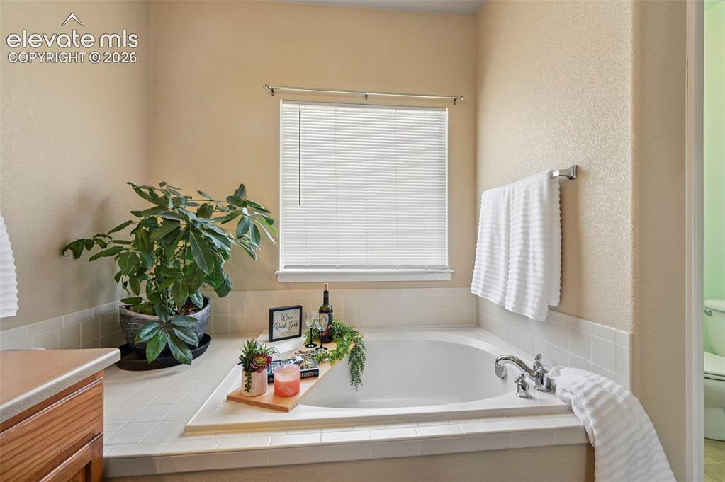 Image 21 of 32: Soaking tub in primary ensuite