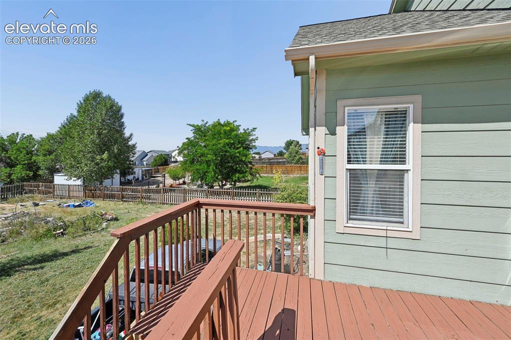Image 29 of 32: Beautiful back deck with mountain views overlooking wide open space