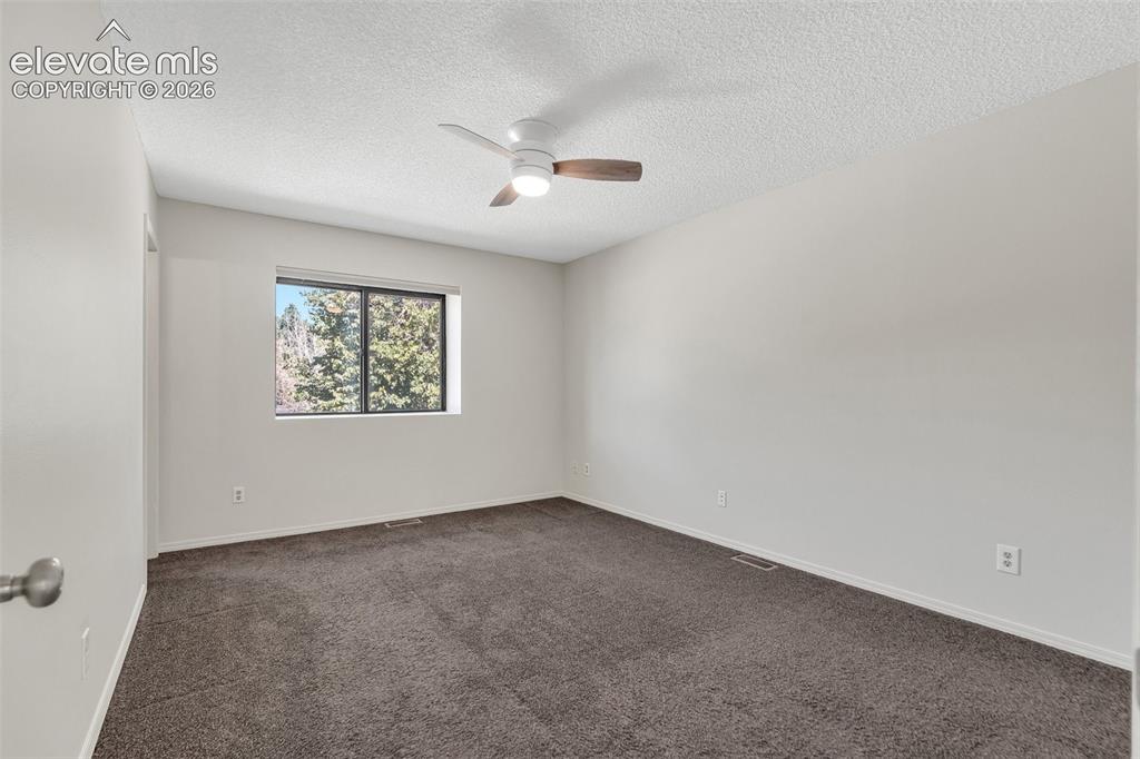 Image 14 of 33: Recessed window, ceiling fan with integrated lighting, wall-to-wall carpeti