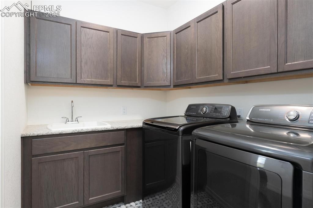 Image 19 of 40: Laundry room with access to the Primary closet and the living room