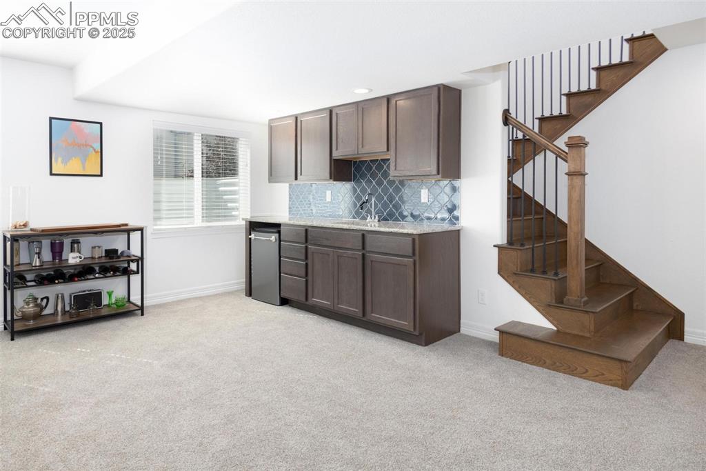 Image 24 of 40: basement wet bar