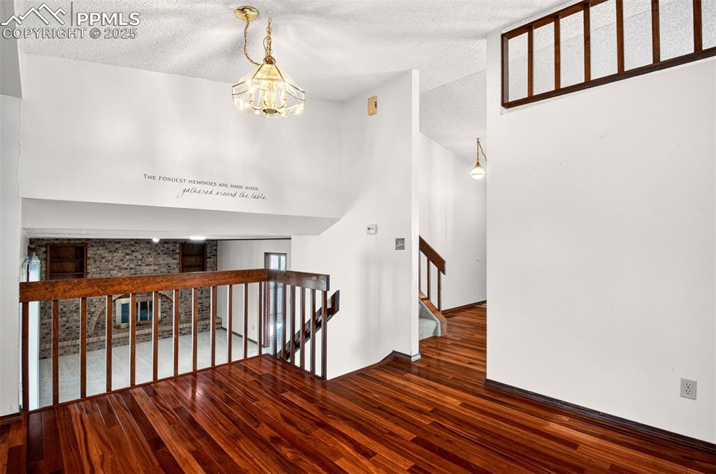 Image 17 of 50: Kitchen toward lower level Family Room and 