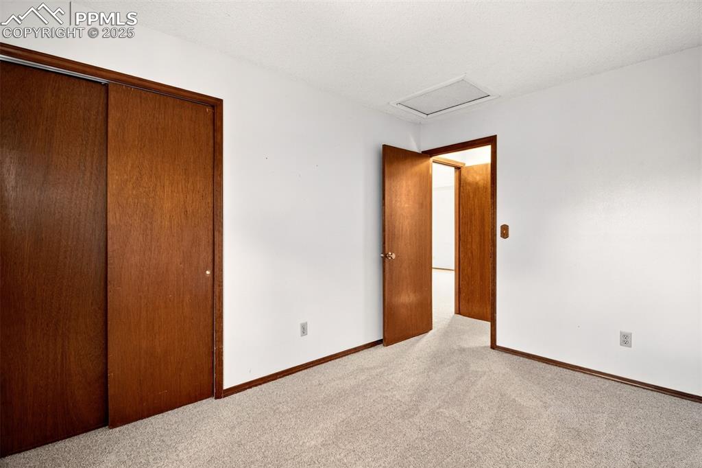 Image 26 of 50: 2nd Bedroom with Full Bathroom across hall on upper level