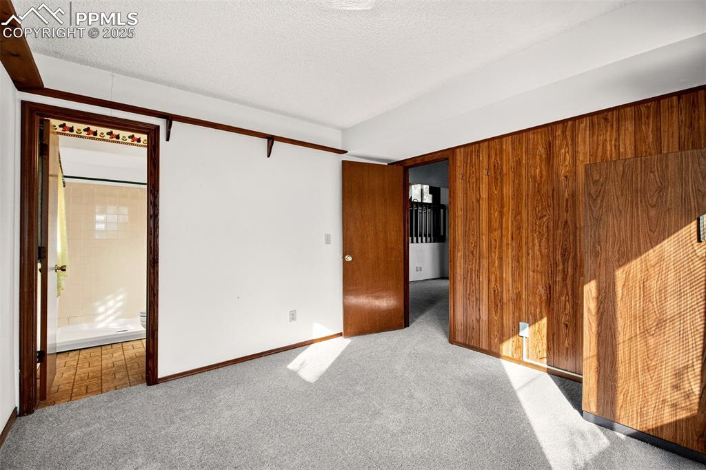 Image 31 of 50: 3rd Bedroom on lower level is off of Family Room, is non-conforming because