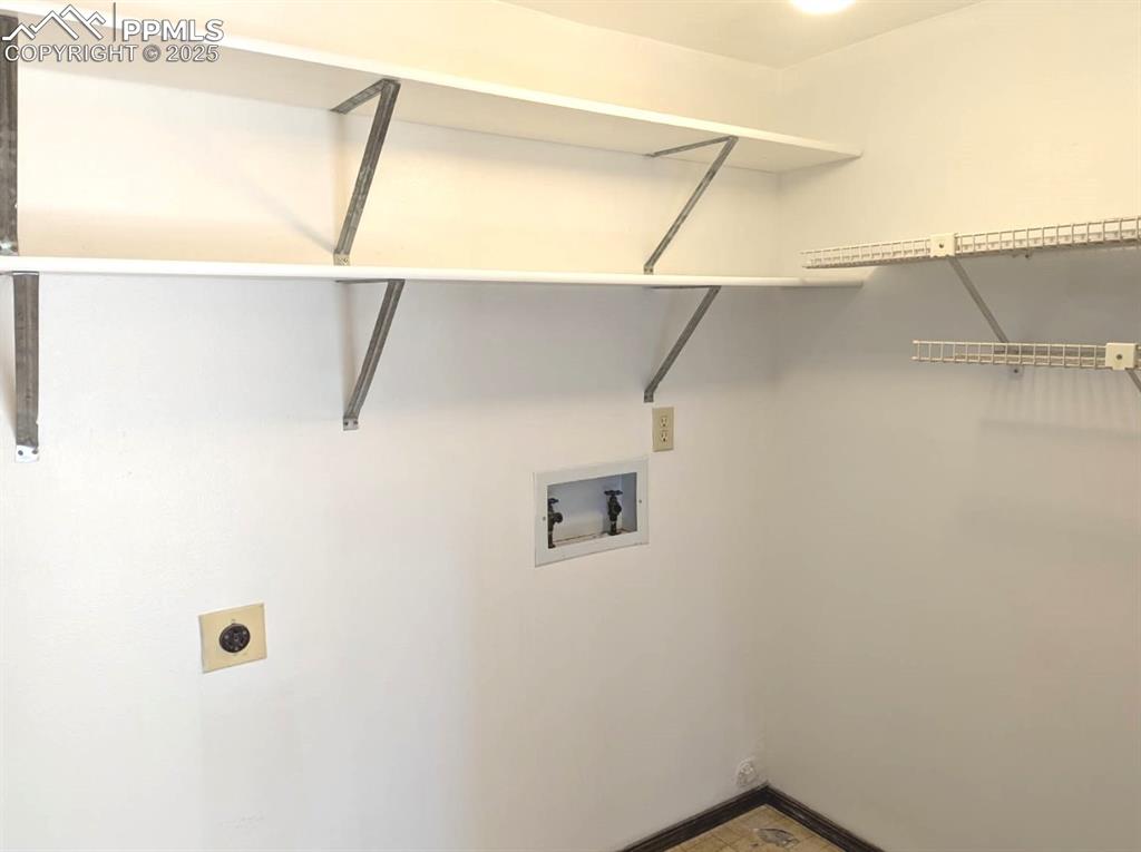 Image 35 of 50: Laundry Room is on Lower Level off of Family Room