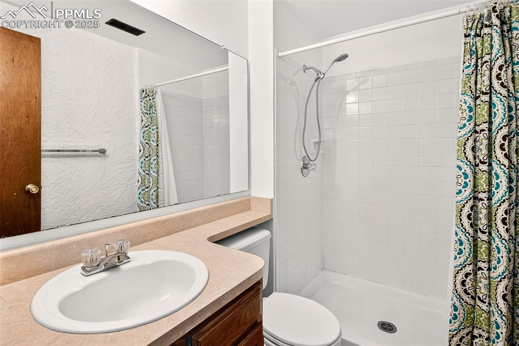 Image 37 of 50: Basement 4th Bedroom has adjoining 3/4 Bathroom