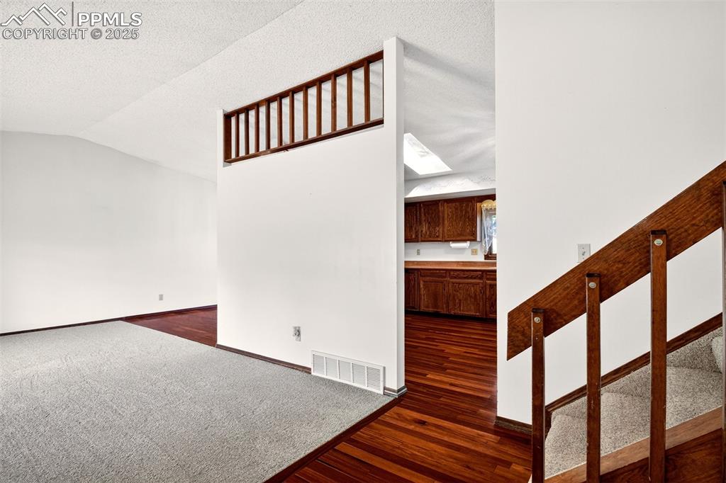 Image 7 of 50: From Entry toward Living room and kitchen - Brand New Carpet on Main, Upper