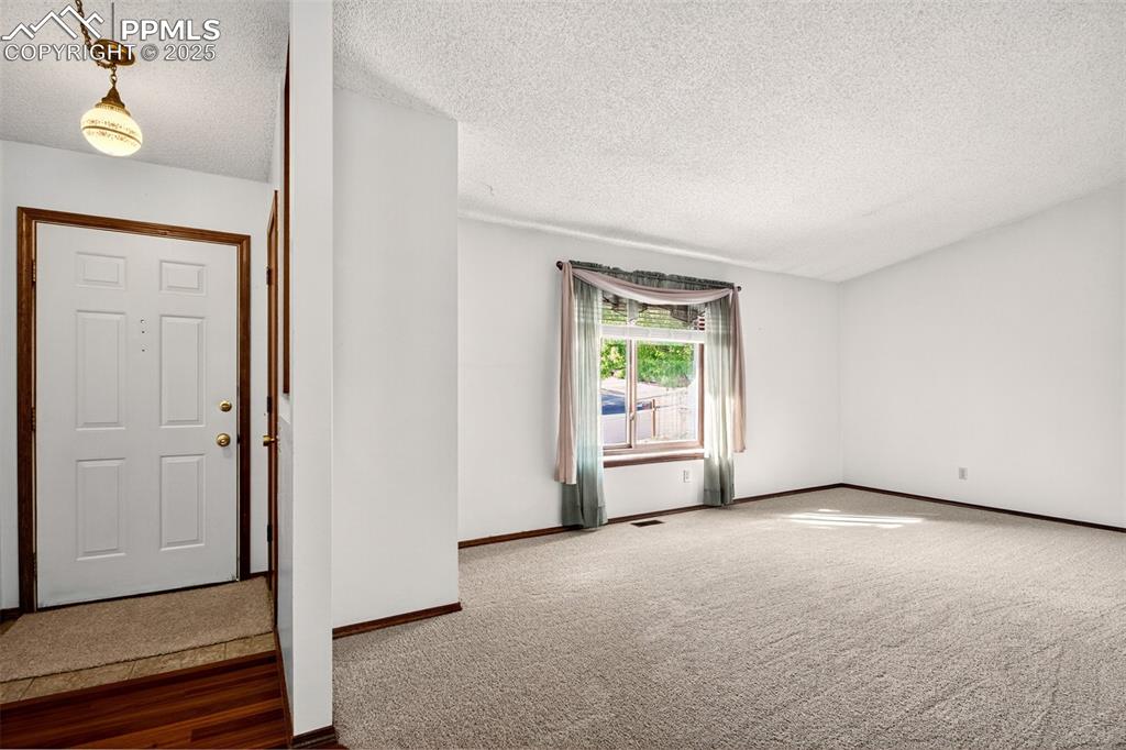 Image 9 of 50: Looking back at Entry and toward Living Room