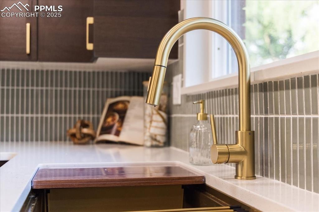 Image 10 of 35: Beautiful brushed gold finishes w designer backsplash