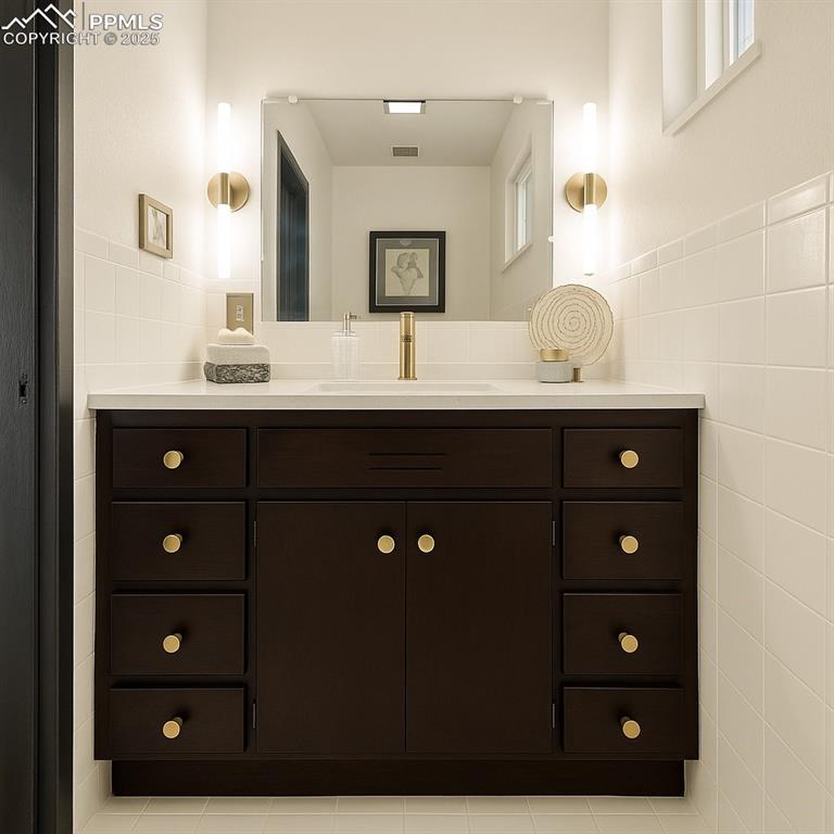 Image 23 of 35: Main floor half bath