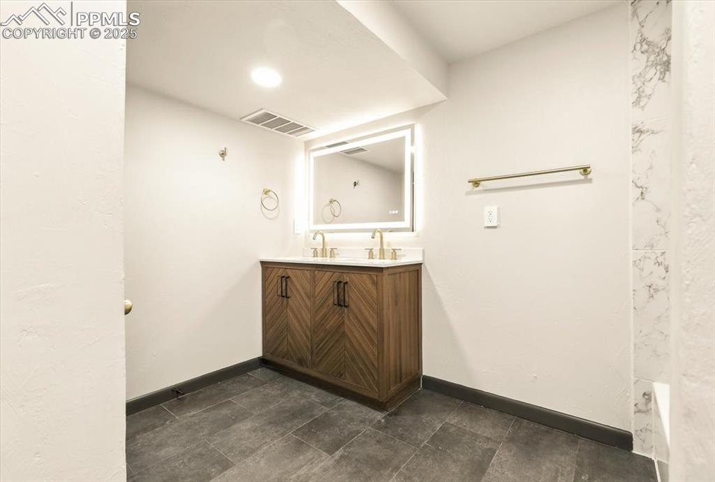 Image 27 of 35: Basement Bathroom