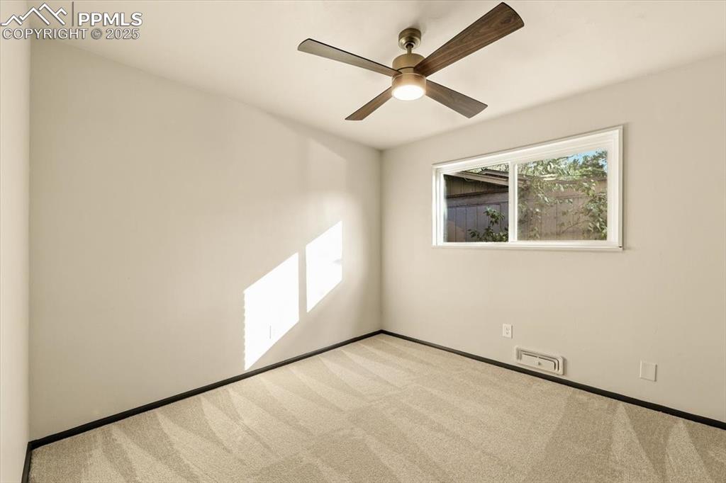 Image 31 of 35: Main level bedroom