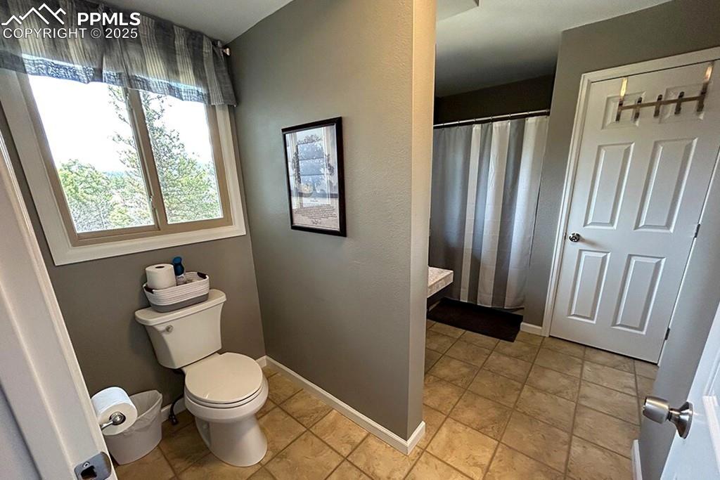 Image 22 of 50: Full bath with vanity and a shower with shower curtain