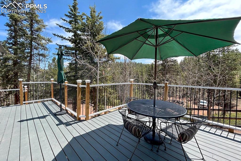 Image 27 of 50: Deck with outdoor dining area