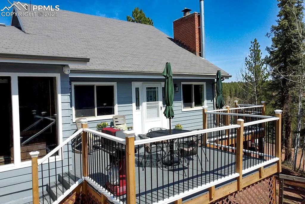 Image 30 of 50: Deck featuring outdoor dining space