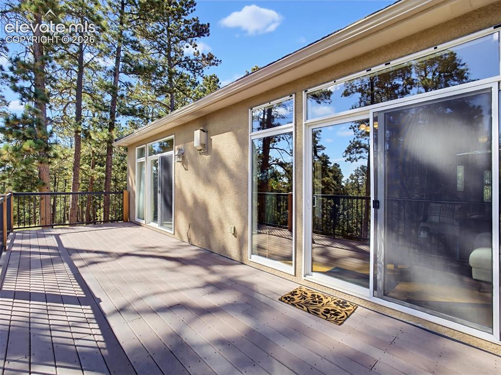 Image 11 of 48: Walk out to the deck from the living area