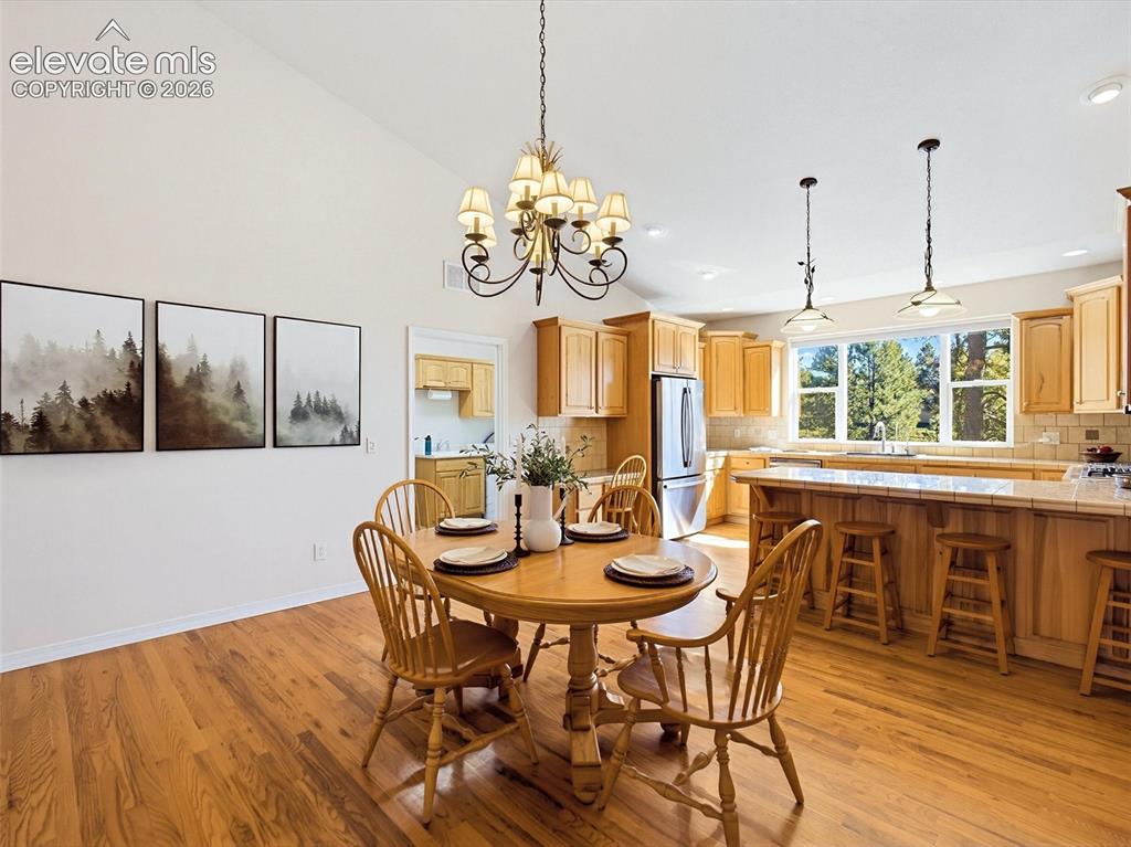 Image 13 of 48: Large dining area adjacent to kitchen