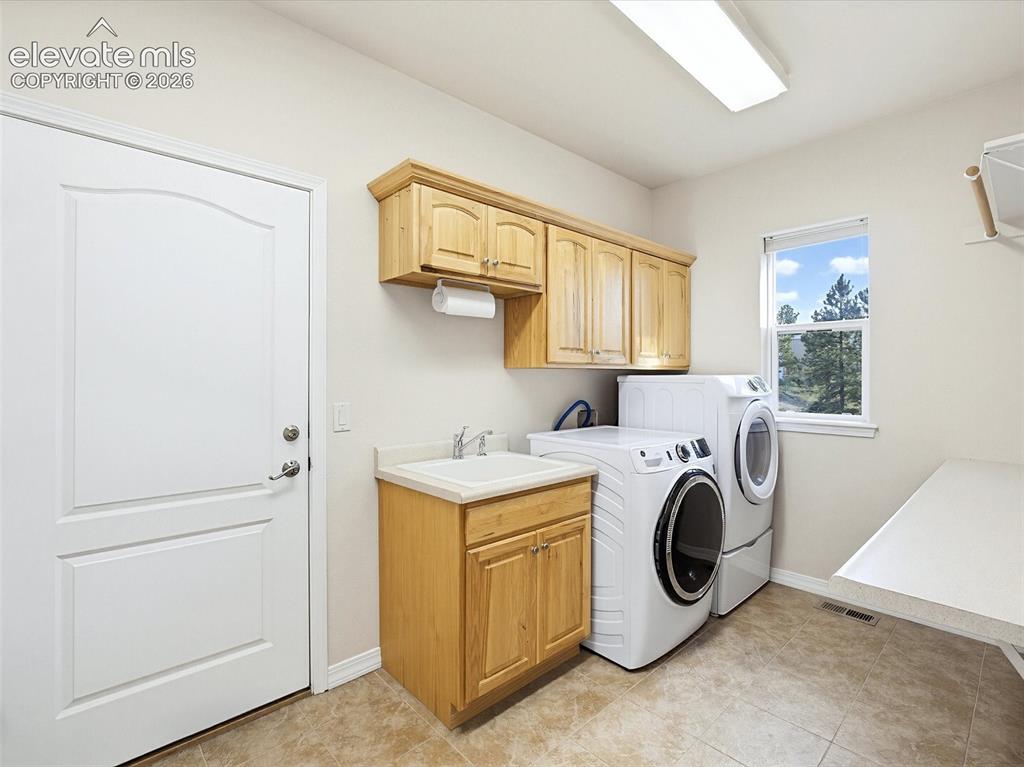 Image 17 of 48: Laundry/mudroom/walk-in pantry