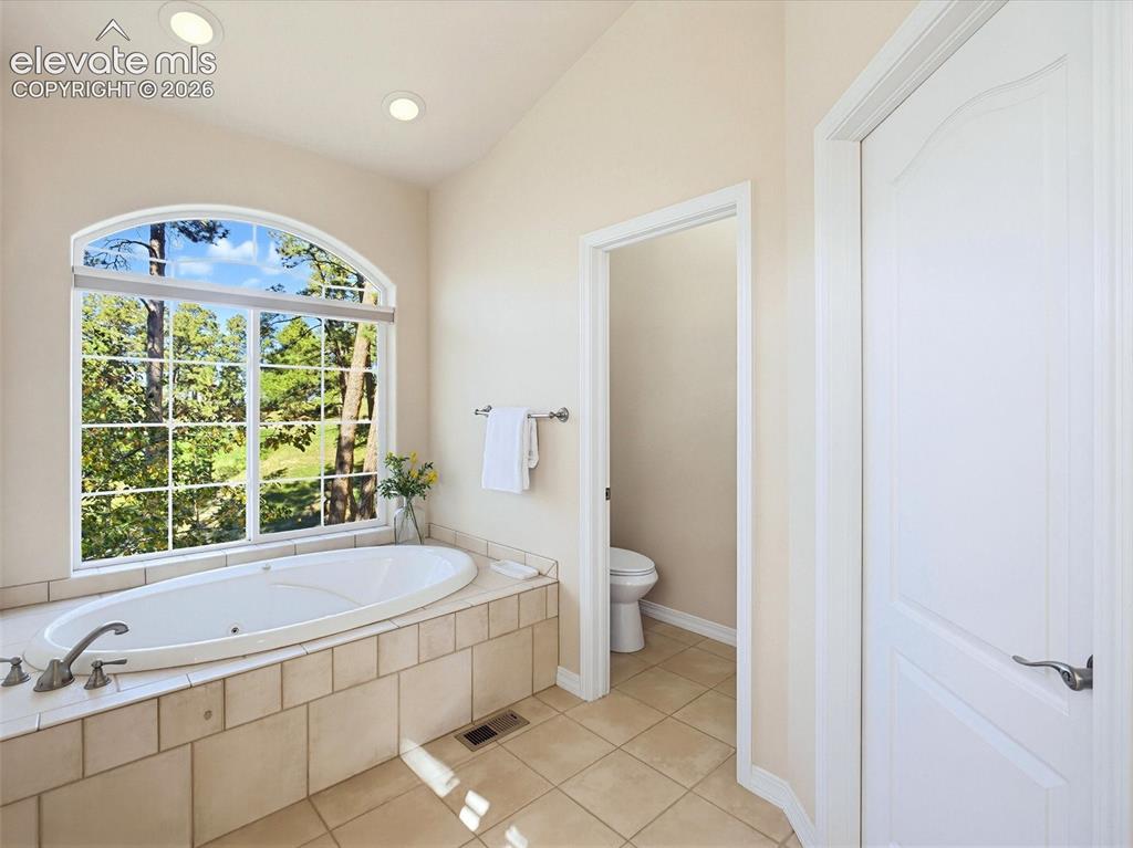 Image 24 of 48: Soaking tub with views