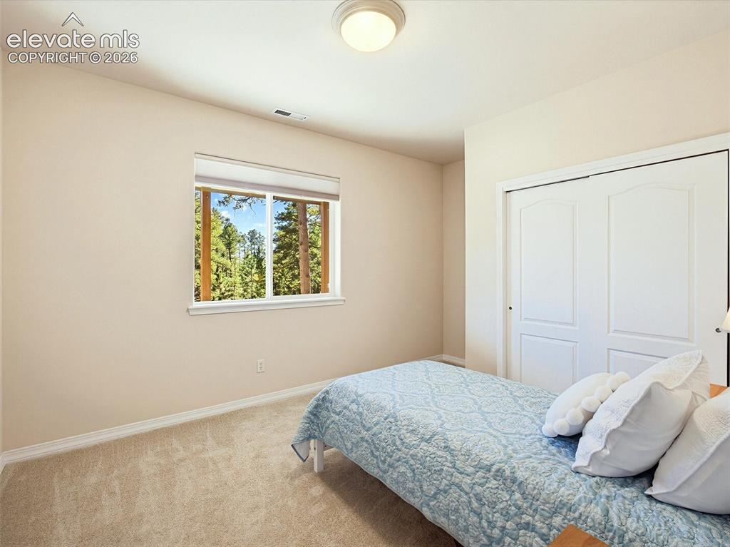 Image 38 of 48: 4th bedroom is also on lower level