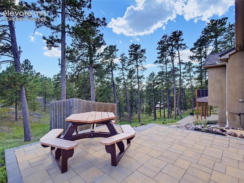 Image 42 of 48: Outdoor eating area with views