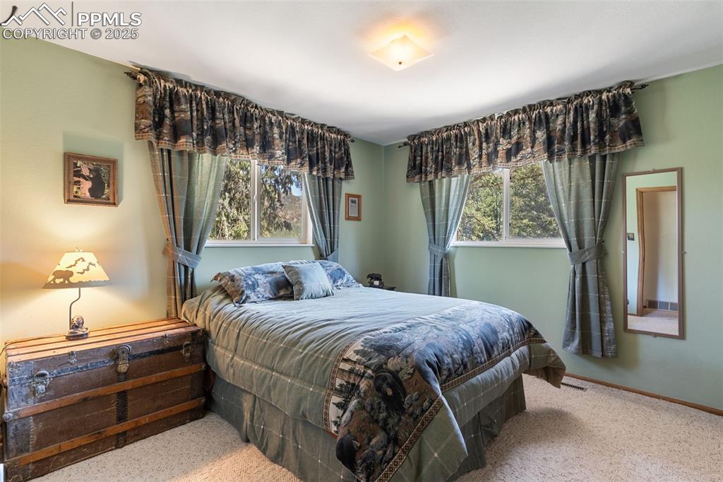 Image 20 of 35: Bedroom with carpet flooring and baseboards