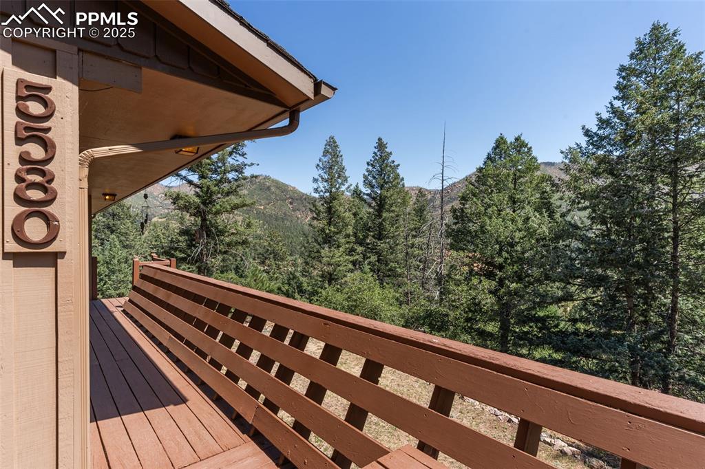 Image 32 of 35: Wooden deck with a mountain view