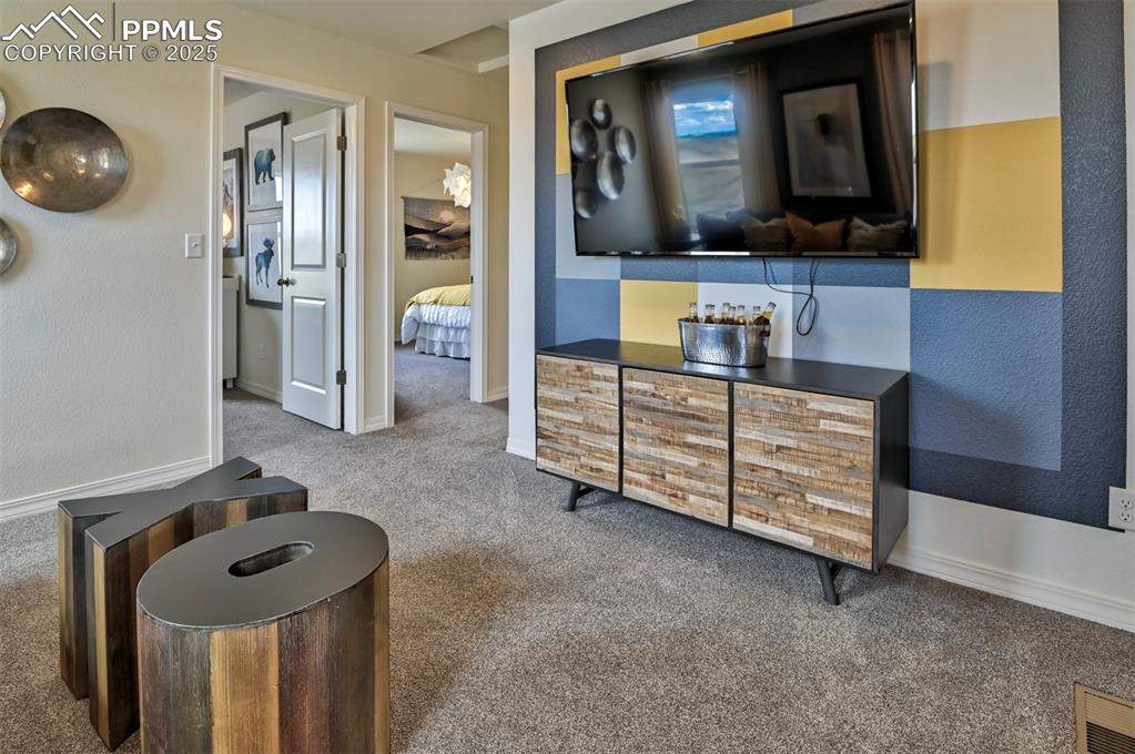 Image 13 of 35: Hallway with carpet and a textured wall