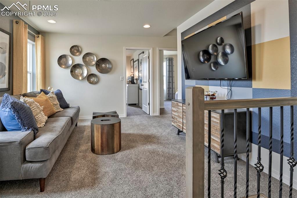 Image 16 of 35: Living room featuring carpet and recessed lighting
