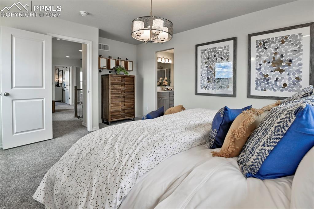 Image 20 of 35: Carpeted bedroom featuring baseboards
