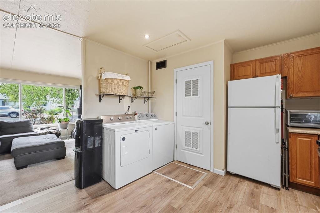 Image 10 of 22: Laundry area in kitchen