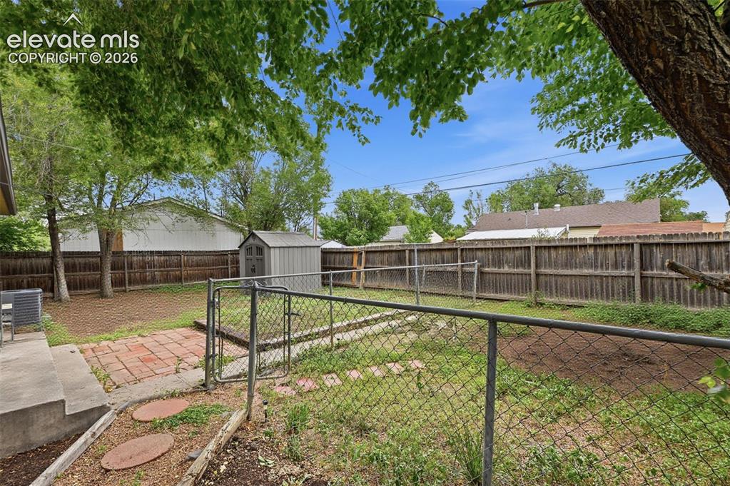 Image 18 of 22: Back yard with great opportunity to make beautiful, gorgeous established tr