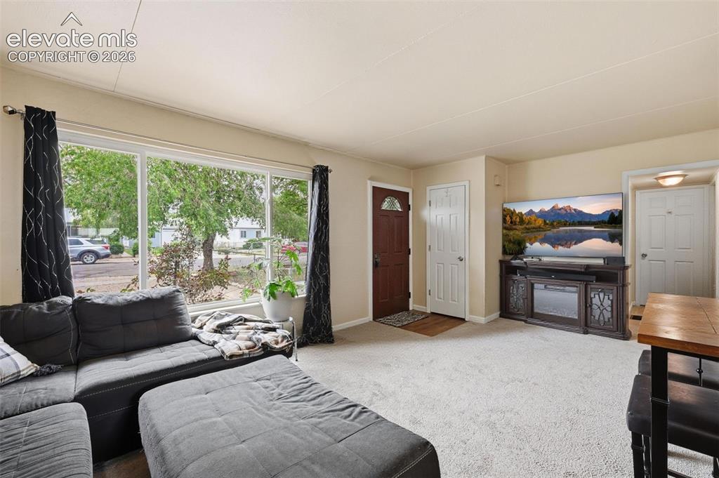 Image 2 of 22: Living room facing entry