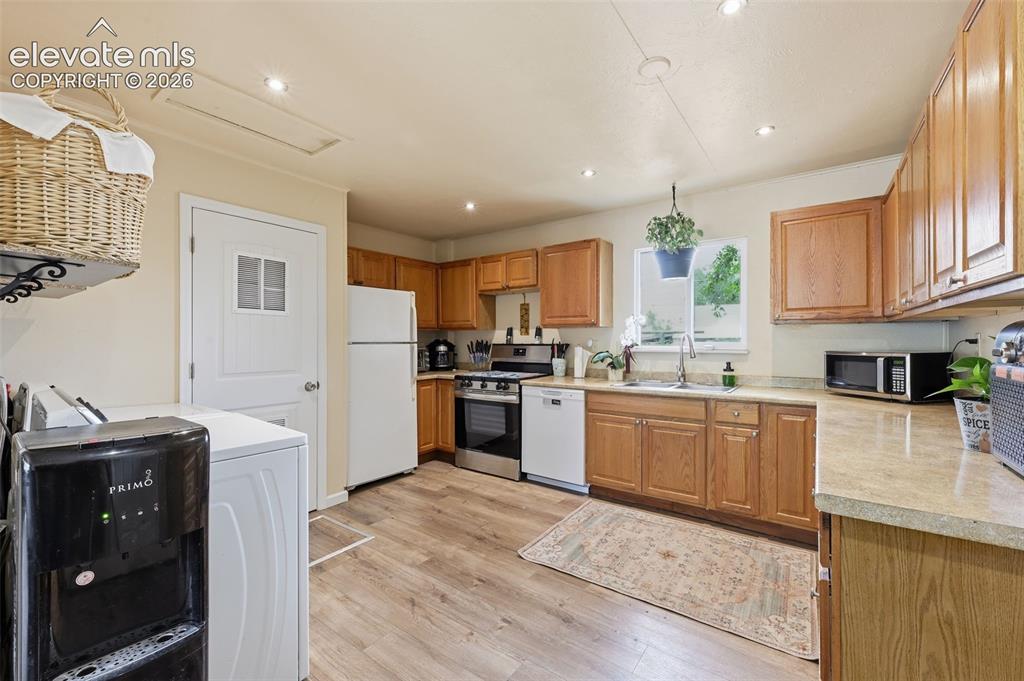 Image 3 of 22: Updated kitchen creating great counter space and cabinets