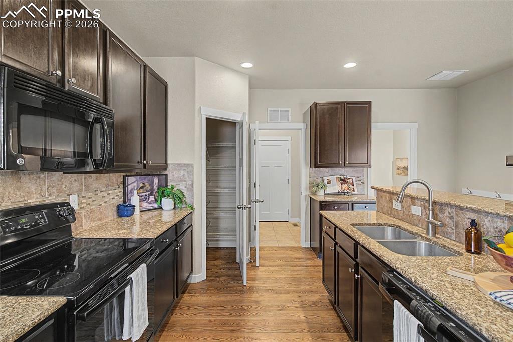 Image 11 of 30: Corner pantry, laundry, powder room