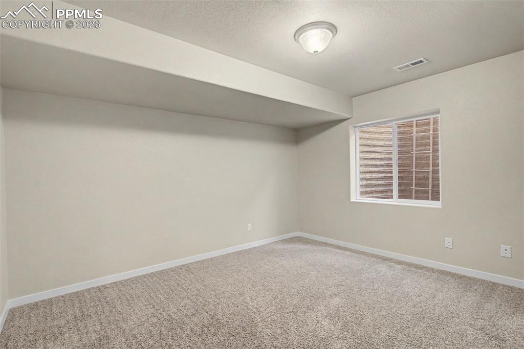 Image 21 of 30: Basement Bedroom